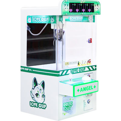 Lámpara LED con monedas Mini Máquina de garras Armario de hardware Fábrica de juegos de peluche para la venta